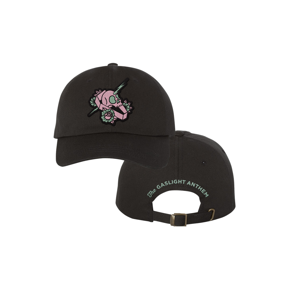 Black baseball cap with a pink skull and flower design on the front.