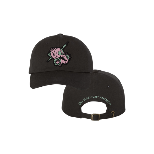 Black baseball cap with a pink skull and flower design on the front.